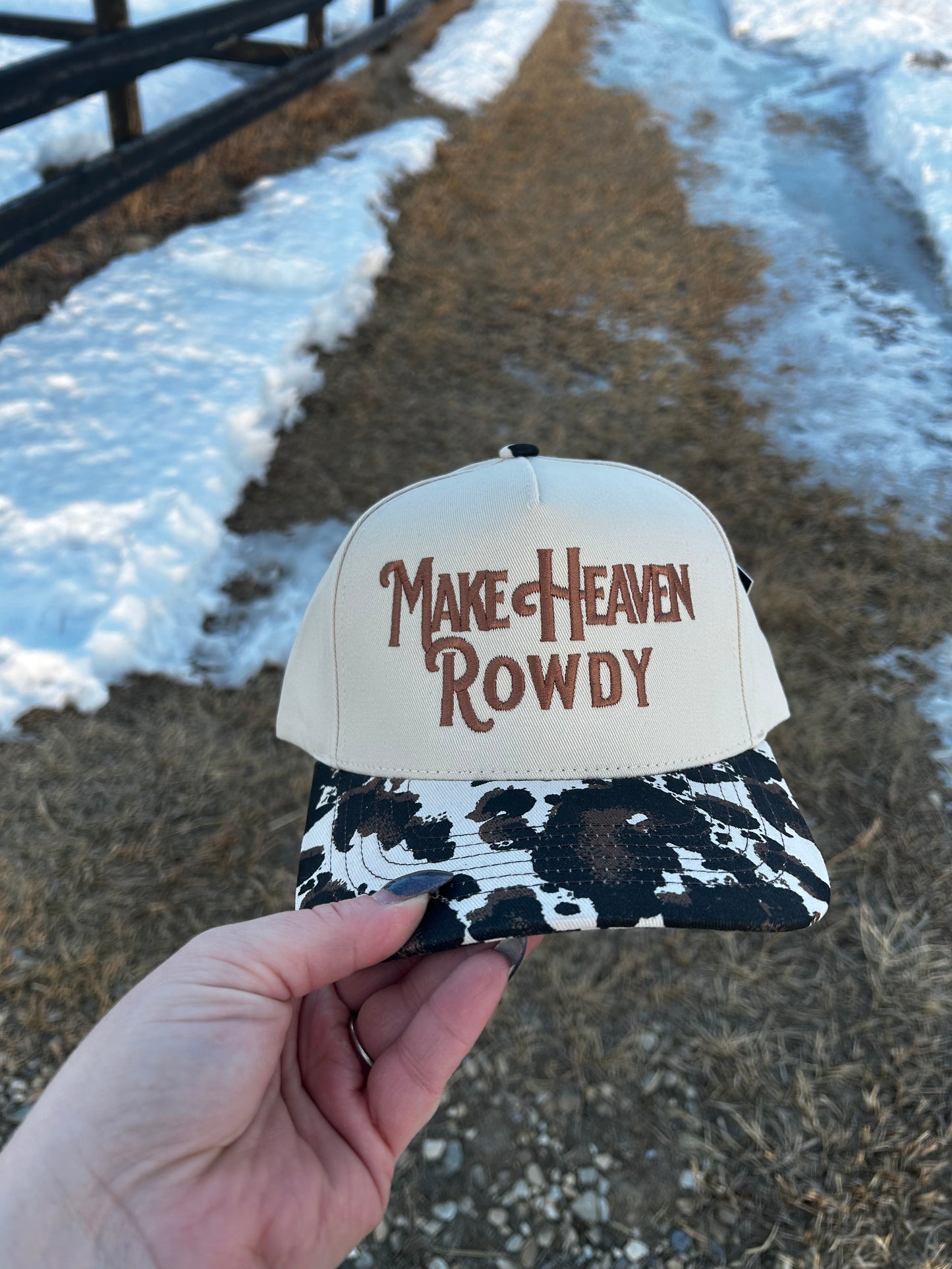 MAKE HEAVEN ROWDY Embroidered Cow Print Brim Trucker Hat